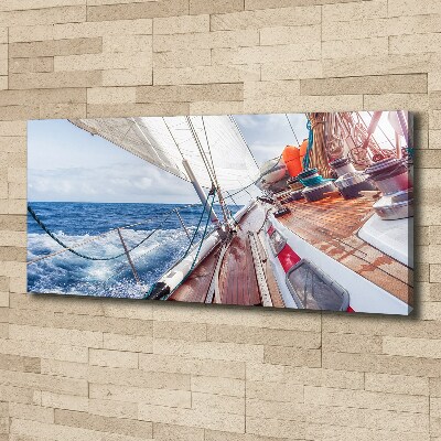 Canvas foto Een zeilboot op zee