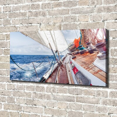 Canvas foto Een zeilboot op zee