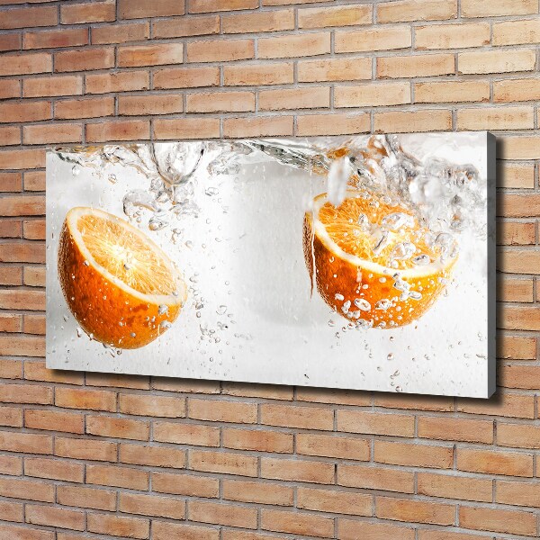 Canvas foto Sinaasappels onder water