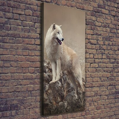 Verticaal schilderij op canvas Wolf op een rots
