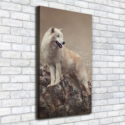 Verticaal schilderij op canvas Wolf op een rots
