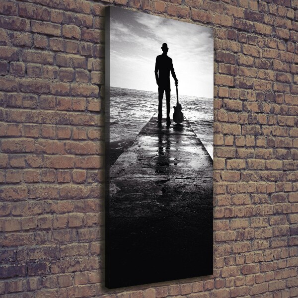 Verticaal schilderij op canvas Gitarist op de pier