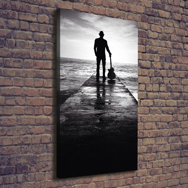 Verticaal schilderij op canvas Gitarist op de pier