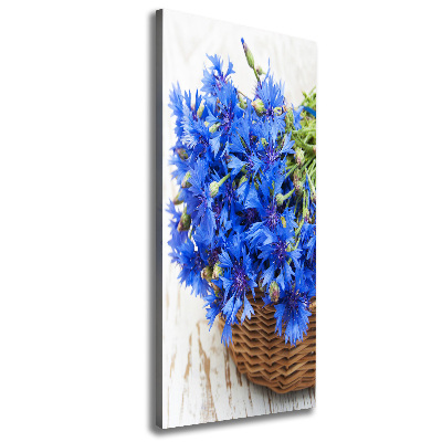 Verticale foto op canvas Korenbloemen in een mand
