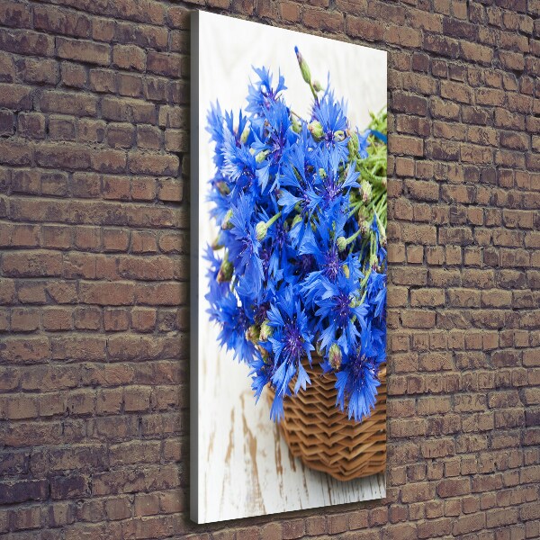 Verticale foto op canvas Korenbloemen in een mand