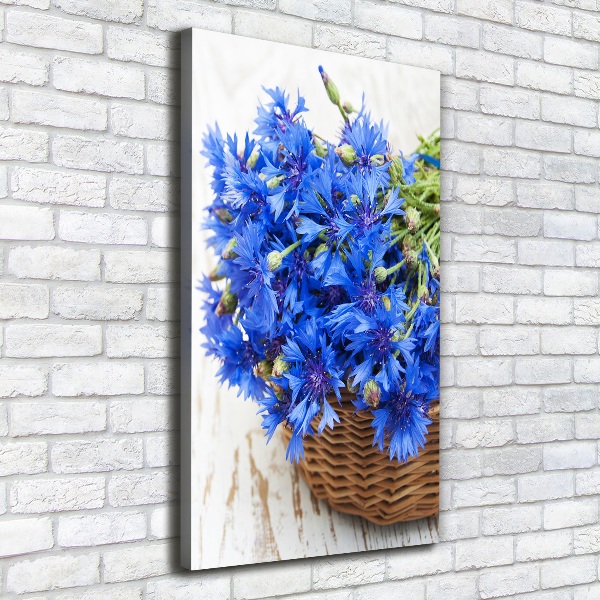 Verticale foto op canvas Korenbloemen in een mand
