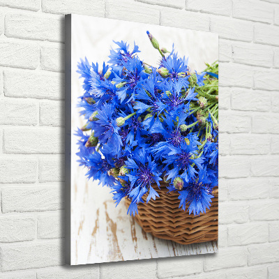 Verticale foto op canvas Korenbloemen in een mand