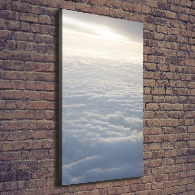 Verticaal schilderij op canvas Vliegen boven de wolken