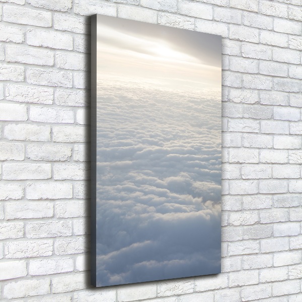 Verticaal schilderij op canvas Vliegen boven de wolken