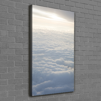 Verticaal schilderij op canvas Vliegen boven de wolken