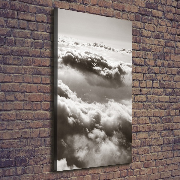 Verticaal canvasschilderij Vliegen boven de wolken