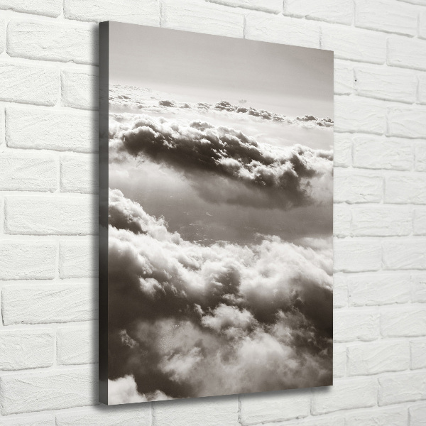 Verticaal canvasschilderij Vliegen boven de wolken