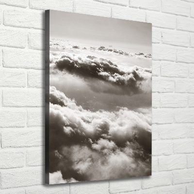 Verticaal canvasschilderij Vliegen boven de wolken