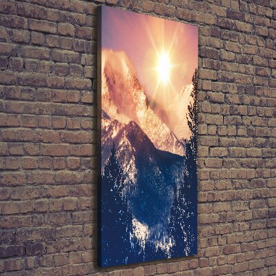 Verticaal canvasschilderij De zon boven de bergen