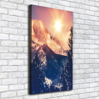 Verticaal canvasschilderij De zon boven de bergen