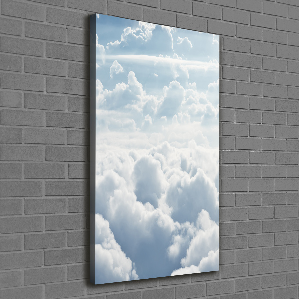Verticale foto op canvas Vliegen boven de wolken