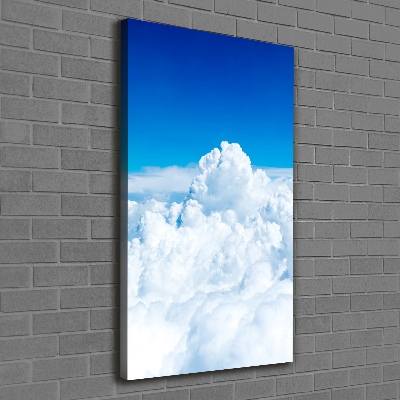Verticaal canvasschilderij Vliegen boven de wolken