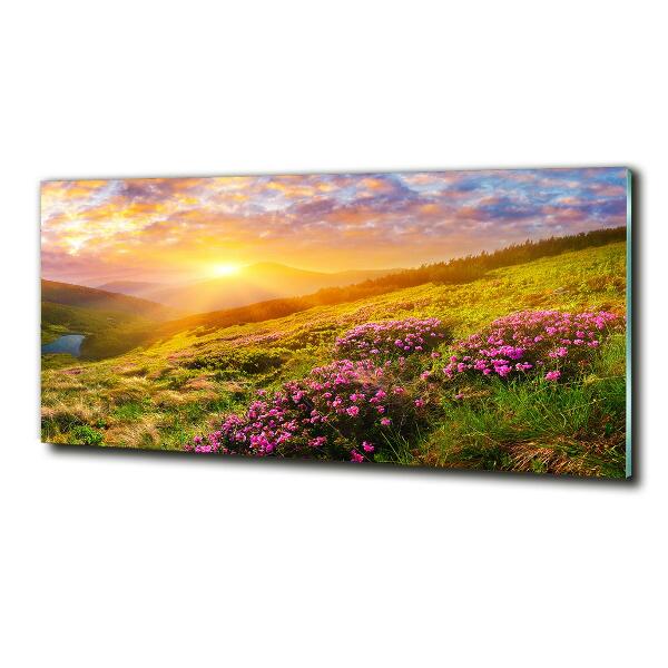 Schilderij glas Zonsondergang boven de bergen