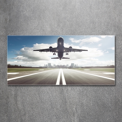 Schilderij op glas Een vliegtuig dat opstijgt