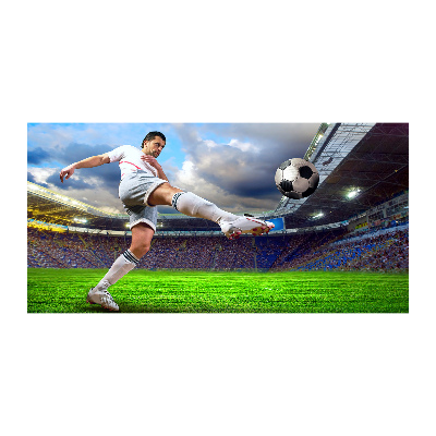 Foto schilderij op glas Een voetballer in het stadion.