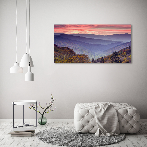 Schilderij op glas Zonsondergang boven de bergen