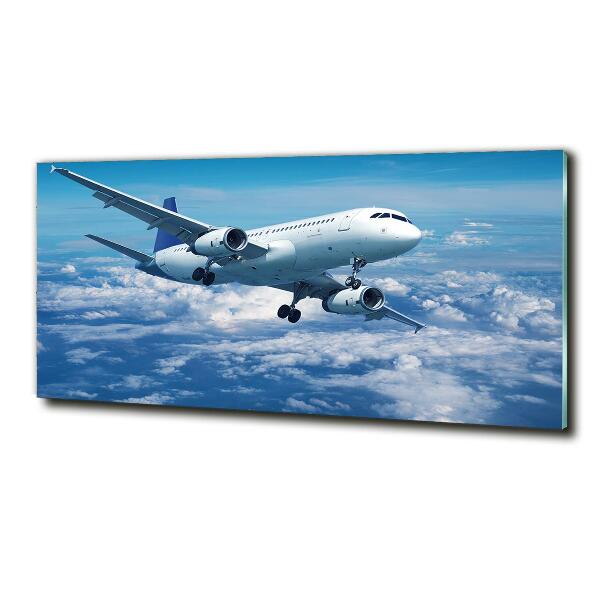 Foto schilderij op glas Een vliegtuig in de wolken