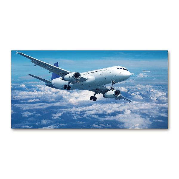 Foto schilderij op glas Een vliegtuig in de wolken