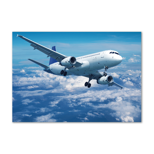 Foto schilderij op glas Een vliegtuig in de wolken