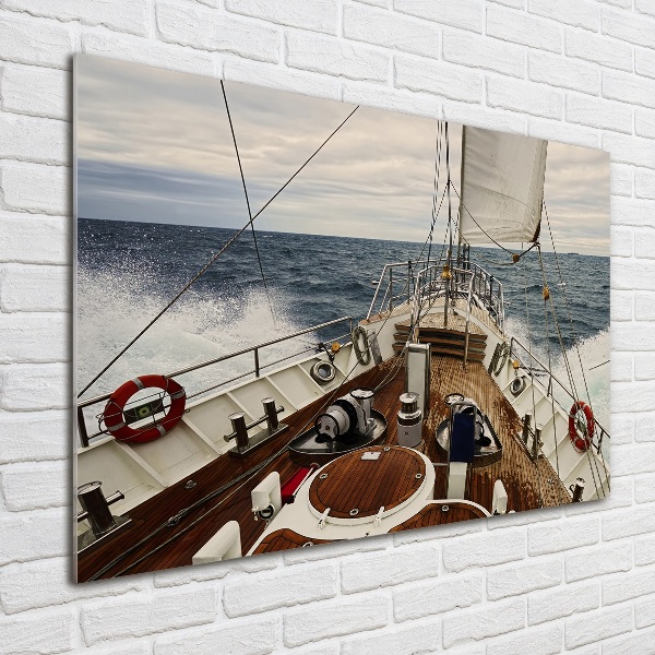 Schilderij op glas Een zeilboot op zee