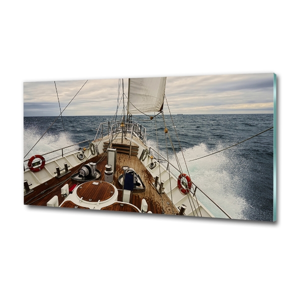 Schilderij op glas Een zeilboot op zee