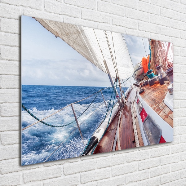Foto schilderij op glas Een zeilboot op zee