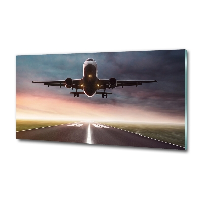 Glazen schilderij Een vliegtuig dat opstijgt