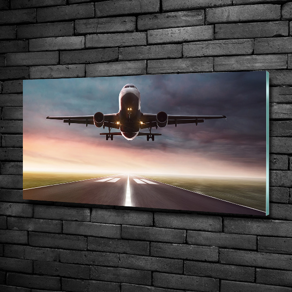 Glazen schilderij Een vliegtuig dat opstijgt