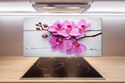 Glazen achterwand keuken Orchidee op hout