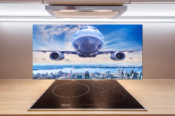 Keuken achterwand Een vliegtuig boven de stad