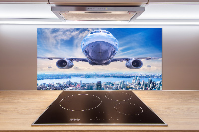 Keuken achterwand Een vliegtuig boven de stad