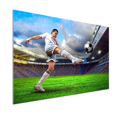 Glazen achterwand keuken Een voetballer in het stadion.