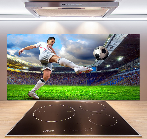 Glazen achterwand keuken Een voetballer in het stadion.