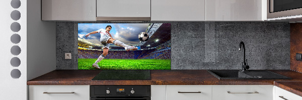 Glazen achterwand keuken Een voetballer in het stadion.
