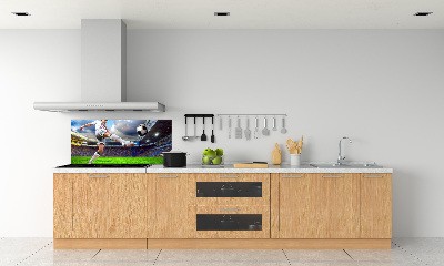 Glazen achterwand keuken Een voetballer in het stadion.
