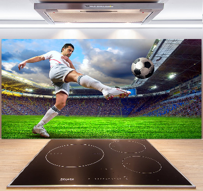 Glazen achterwand keuken Een voetballer in het stadion.