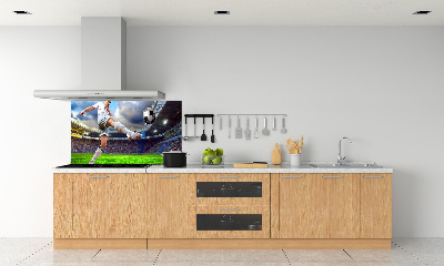 Glazen achterwand keuken Een voetballer in het stadion.