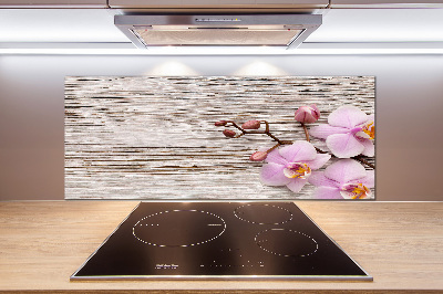 Glazen achterwand keuken Orchidee op hout