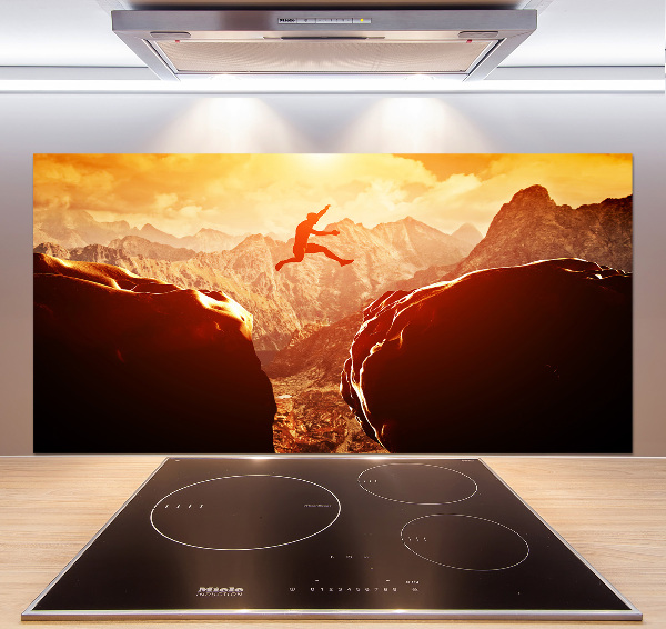 Spatscherm keuken Spring over de afgrond