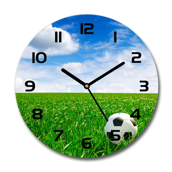 Ronde glas klok Voetbal op het veld