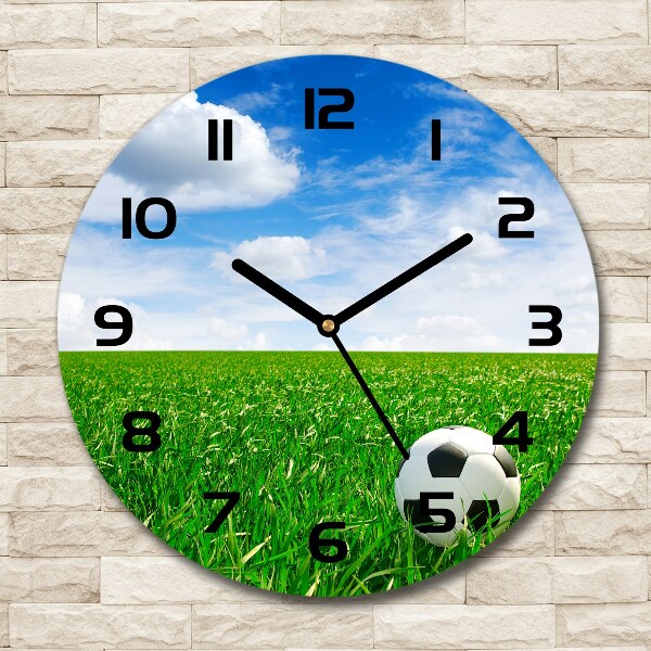 Ronde glas klok Voetbal op het veld