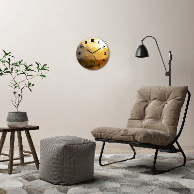 Ronde glazen klok Zonsondergang boven de bergen