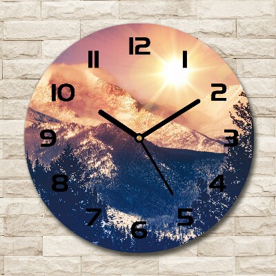 Ronde glazen wandklok De zon boven de bergen