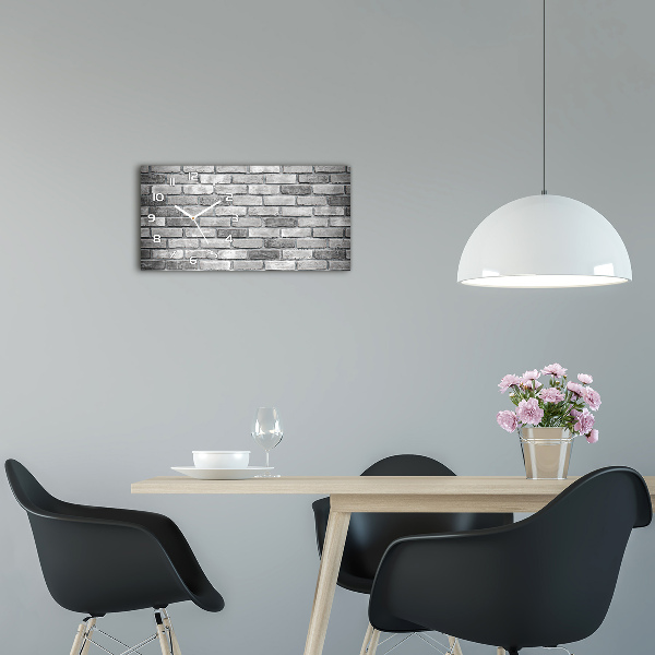 Langwerpige wandklok van glas Bakstenen muur