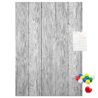 Kurken prikbord met een achtergrond van grijze houten planken